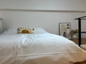 Een bed of bedden in een kamer bij 礁溪 Hao Hao