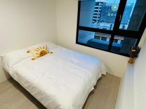 Een bed of bedden in een kamer bij 礁溪 Hao Hao
