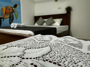 Letto o letti in una camera di TaMaRiNd house