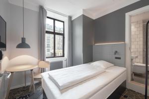 A bed or beds in a room at Four Points Flex by Sheraton Copenhagen City