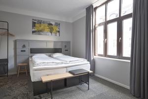 A bed or beds in a room at Four Points Flex by Sheraton Copenhagen City