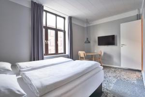 A bed or beds in a room at Four Points Flex by Sheraton Copenhagen City