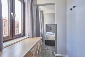 A bed or beds in a room at Four Points Flex by Sheraton Copenhagen City