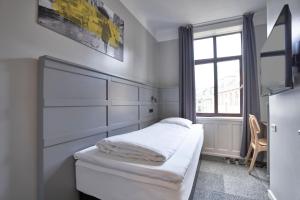 A bed or beds in a room at Four Points Flex by Sheraton Copenhagen City