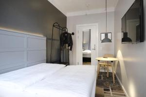A bed or beds in a room at Four Points Flex by Sheraton Copenhagen City