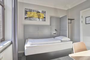 A bed or beds in a room at Four Points Flex by Sheraton Copenhagen City