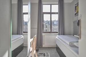 A bed or beds in a room at Four Points Flex by Sheraton Copenhagen City