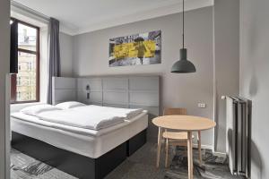 A bed or beds in a room at Four Points Flex by Sheraton Copenhagen City