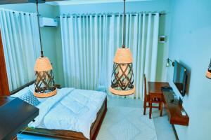 Ένα ή περισσότερα κρεβάτια σε δωμάτιο στο Birds of Paradise Homes 2