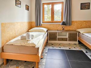Posteľ alebo postele v izbe v ubytovaní Apartmány Klatovská
