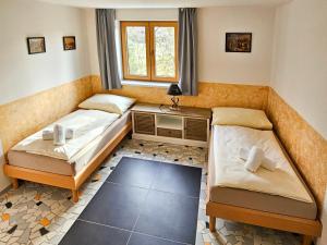 Posteľ alebo postele v izbe v ubytovaní Apartmány Klatovská