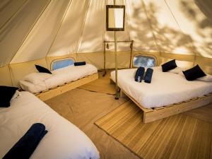 Lodg'ing Nature Camp Anjou客房内的一张或多张床位