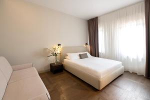 Letto o letti in una camera di Hotel Carlton