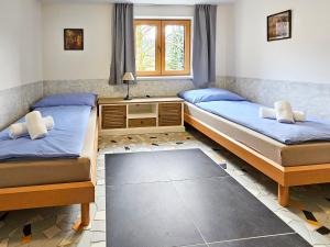 Posteľ alebo postele v izbe v ubytovaní Apartmány Klatovská