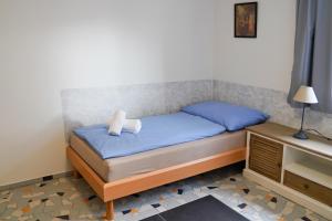 Posteľ alebo postele v izbe v ubytovaní Apartmány Klatovská