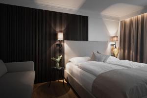 Ένα ή περισσότερα κρεβάτια σε δωμάτιο στο Hotel Schachner