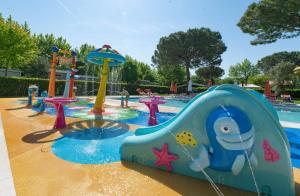 a childrens water park with a water slide at Italy Camping Village in Cavallino-Treporti +69 photos