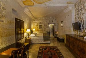 Postel nebo postele na pokoji v ubytování Yunak Evleri Cappadocia