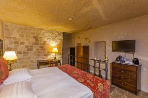 Postel nebo postele na pokoji v ubytování Yunak Evleri Cappadocia
