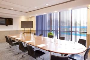 a large conference room with a large table and chairs at Stamford Bridge Hotel London in London