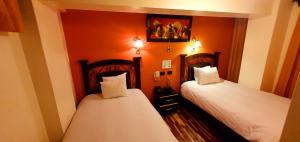 Letto o letti in una camera di Hotel Cusco Museo