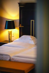 Postel nebo postele na pokoji v ubytování Relais & Châteaux Bülow Palais