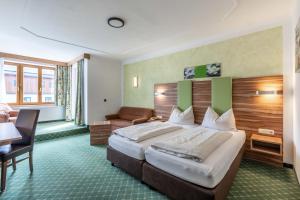 Letto o letti in una camera di Hotel Post by keyone