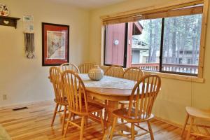 a dining room with a wooden table and chairs at 8 Leisure in Sunriver