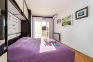 Postel nebo postele na pokoji v ubytování Apartment Stipe