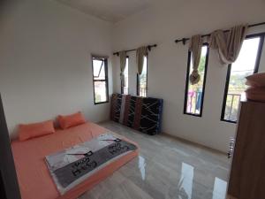 Tempat tidur dalam kamar di Villa Cassandra