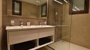 a bathroom with a sink and a shower at Tulip Star Hawana in Salalah +16 photos