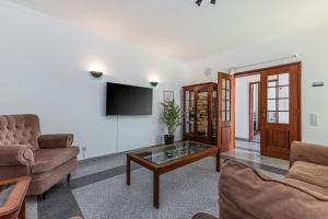 a living room with a couch and a coffee table at Chilling In Lagos House Retreat by Algarve Golden Properties in Lagos