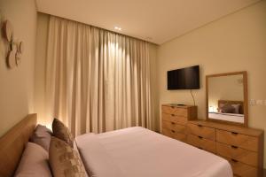 TV a/nebo společenská místnost v ubytování Tulip Star Hawana