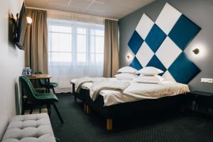 Postel nebo postele na pokoji v ubytování Centrum Hotel Viljandi