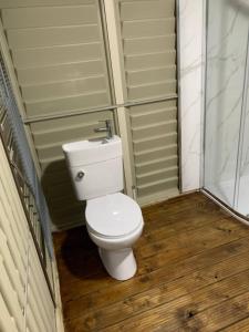 a bathroom with a toilet in a room at The Roundhouse Yurt in Colchester +11 photos