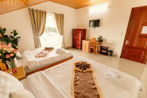 Postel nebo postele na pokoji v ubytování Lê Mùi Hotel - Apartment