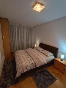 Postel nebo postele na pokoji v ubytování Apartment Block D