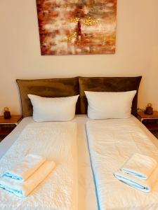 Postel nebo postele na pokoji v ubytování Apartments La Rosa