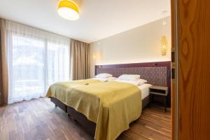 Łóżko lub łóżka w pokoju w obiekcie Hotel Allegra 3 Stern Superior
