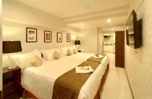 Postel nebo postele na pokoji v ubytování Le Tour Hotel Akihabara Ekimae 楽途ホテル秋葉原駅前店