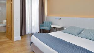 Кровать или кровати в номере Sol Torremolinos - Don Pedro