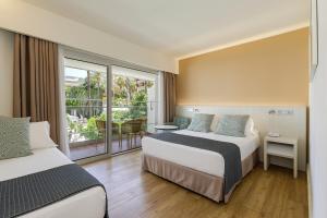 Кровать или кровати в номере Sol Torremolinos - Don Pedro