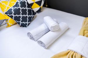 two rolls of toilet paper sitting on a table at Quiet Top-Floor Retreat -Modern Studio for 2 - Islington in London
