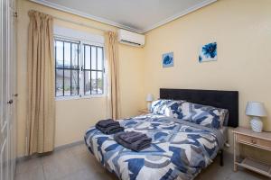 Postel nebo postele na pokoji v ubytování CH Casa Marie Benimar + 19 fotografií