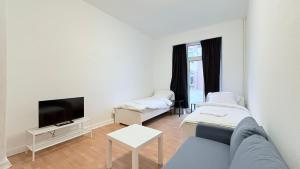 Televisyen dan/atau pusat hiburan di Zentrale Apartments in Neumünster ideal für Geschäftsreisende & Monteure