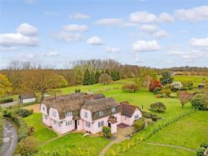 an aerial view of a large house in a field at Blackbrook Farmhouse in Colchester