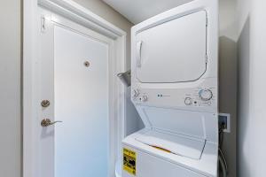 a white washer and dryer in a room at Relaxation Station in Key Colony Beach