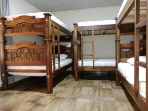 a group of bunk beds in a room at Finca la mariana in Pereira +10 photos
