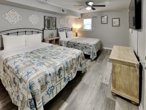 Ένα ή περισσότερα κρεβάτια σε δωμάτιο στο Pleasure Pier Retreat #3