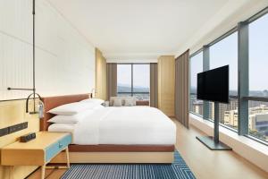 Postel nebo postele na pokoji v ubytování Four Points by Sheraton Xuancheng, Jingxian + 37 fotografií